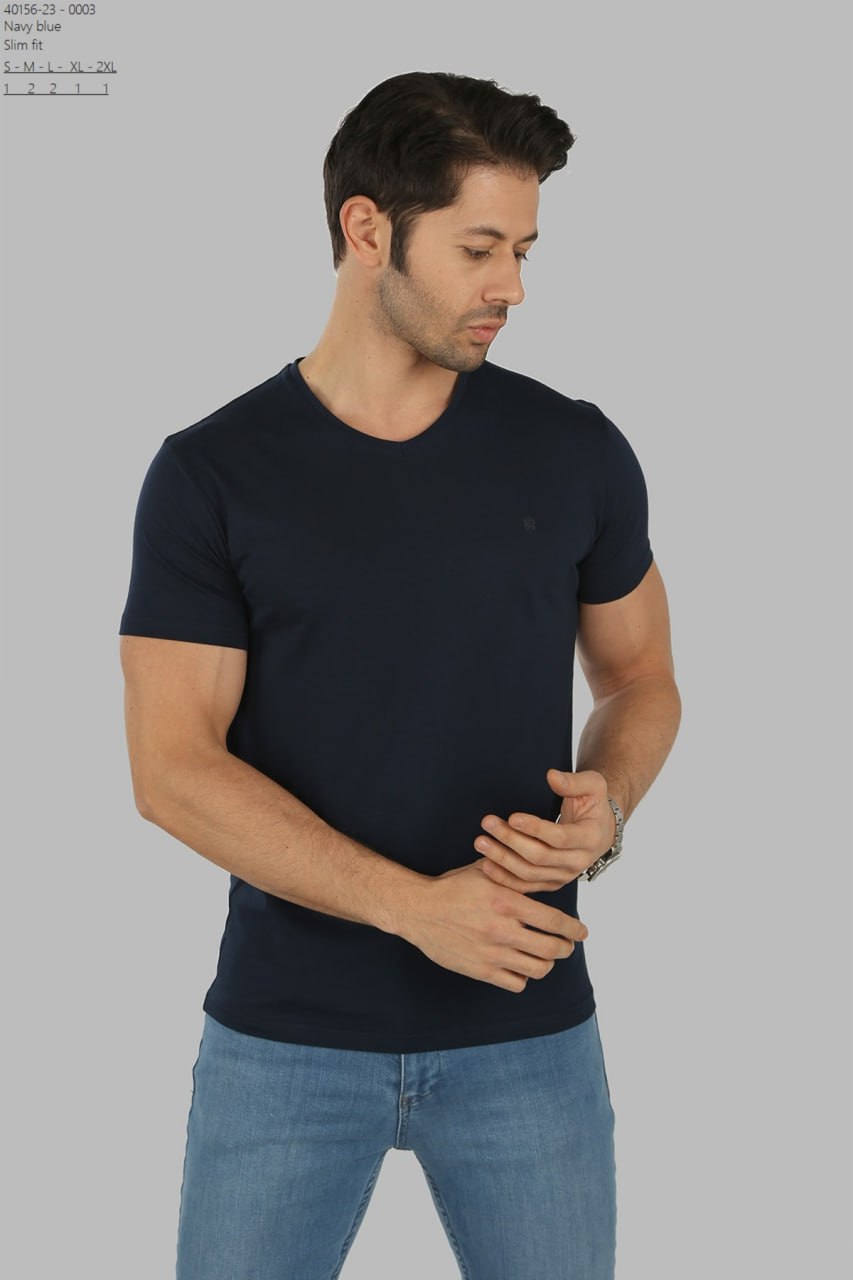 
Male model wearing a fitted Brango premium navy blue v-neck t-shirt paired with light blue denim jeans, imported from Türkiye.